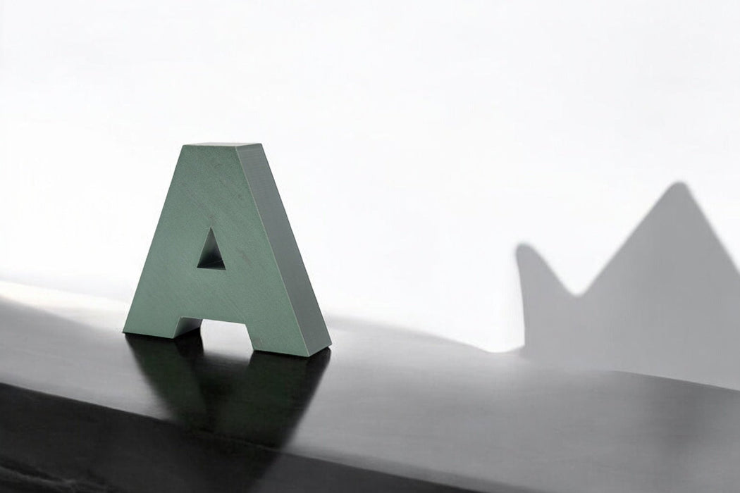 Letra 3D Verde Interferencia